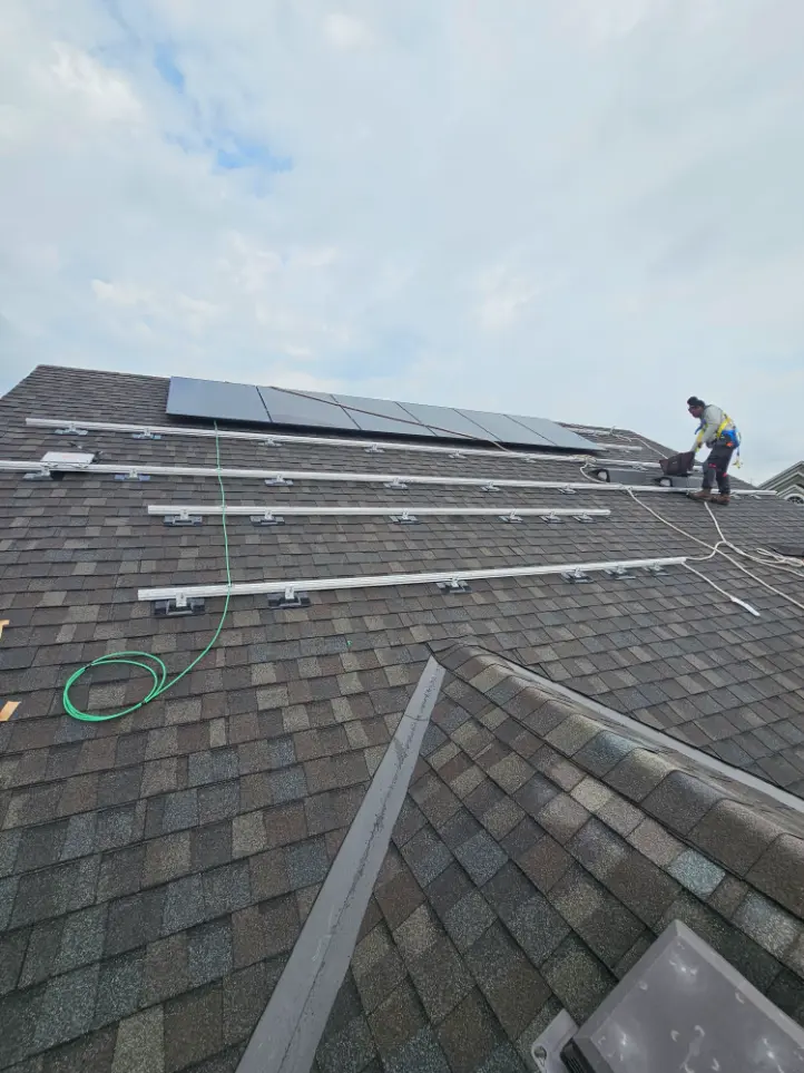 installing solar panel on a shingle roofing